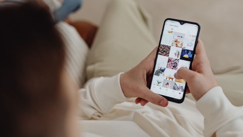 Social media feed being browsed on a smartphone