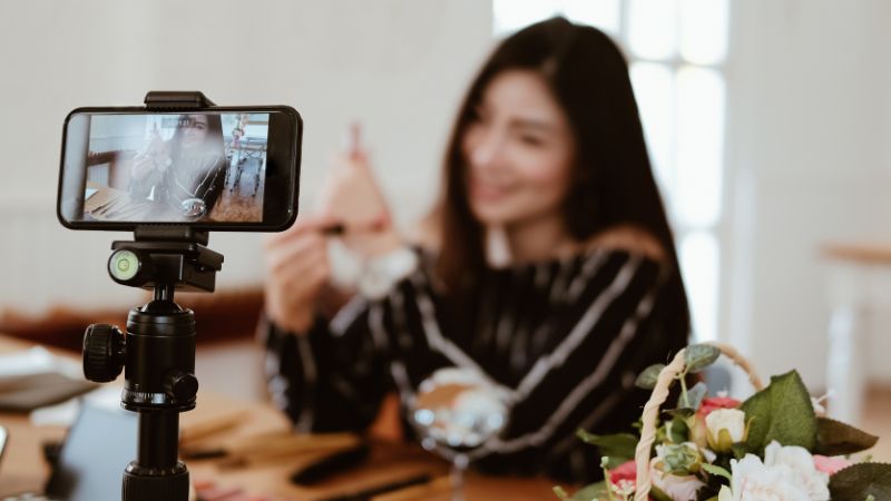 Content creator recording video in a professional studio setup