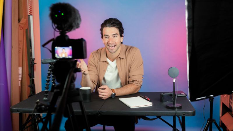 Influencer creating content with phone on tripod